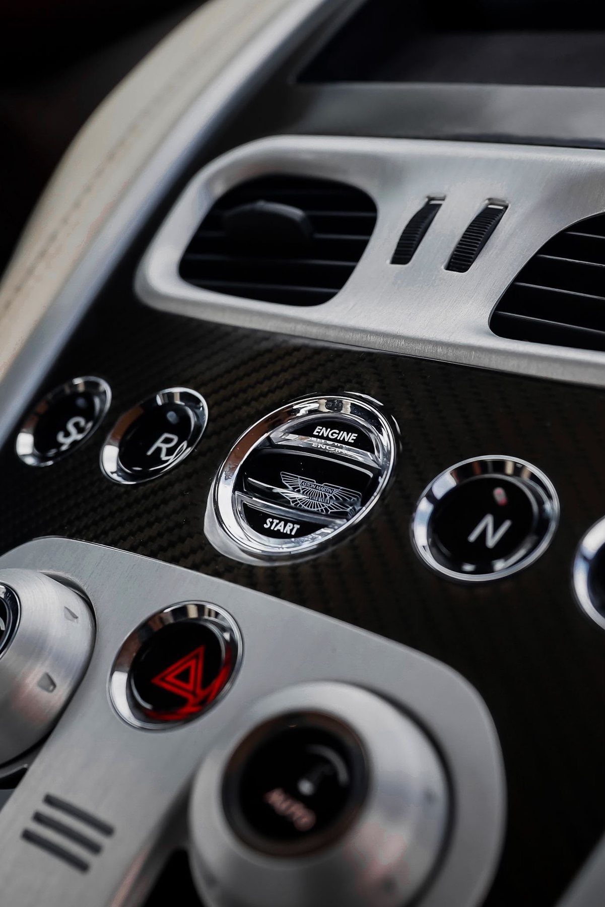 Aston Martin engine start button — contact Driver Society Stuttgart
